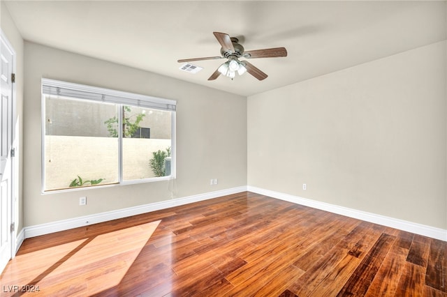 unfurnished room featuring hardwood / wood-style flooring and ceiling fan