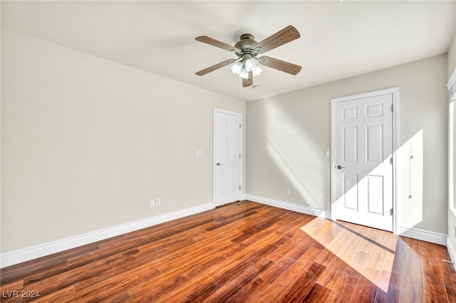 spare room featuring hardwood / wood-style flooring and ceiling fan