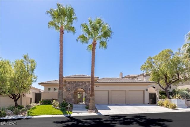 view of front of property with a garage