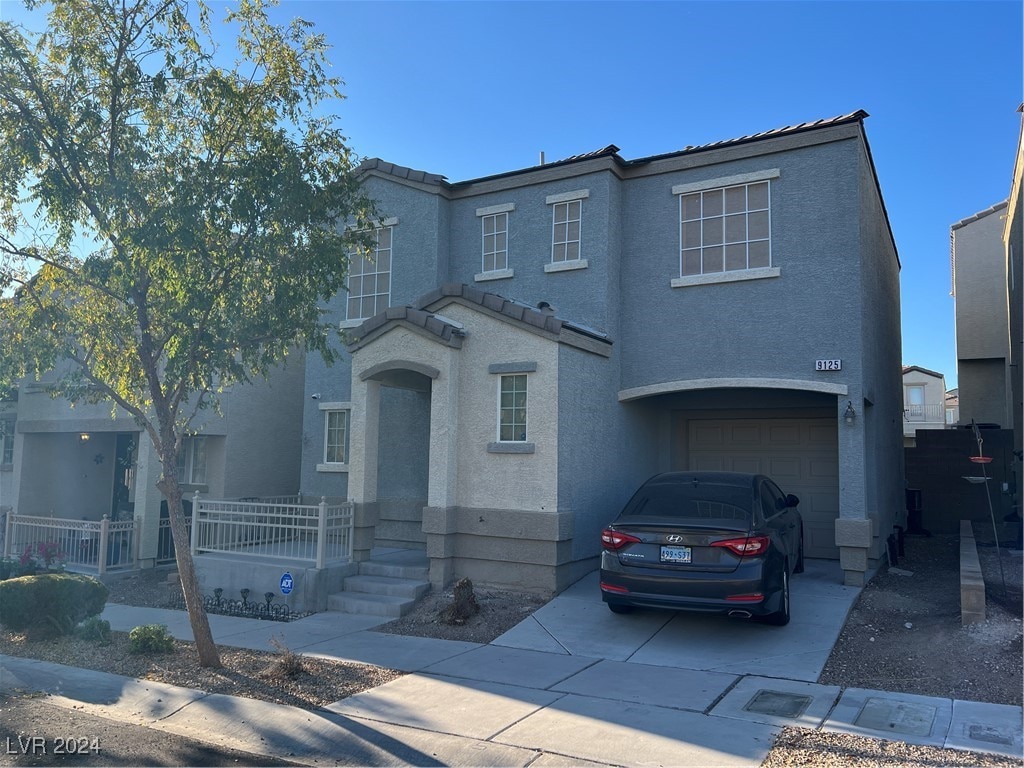 view of front of home with a garage