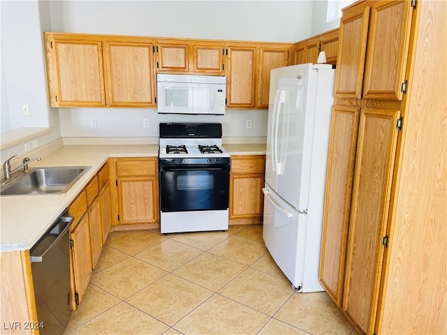 kitchen with sink, light tile patterned floors, and white appliances