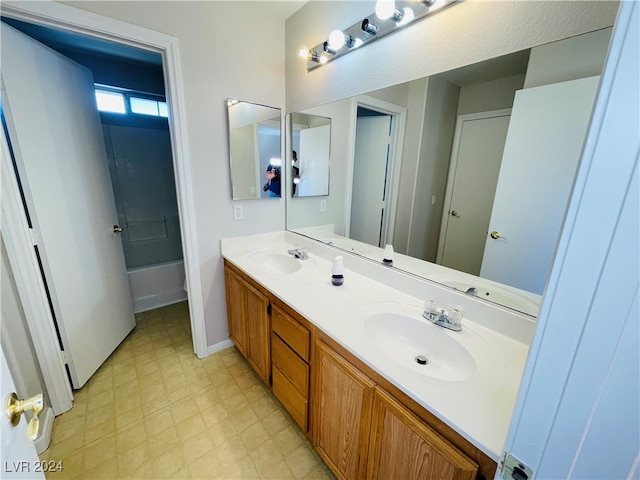 bathroom featuring vanity and bathing tub / shower combination