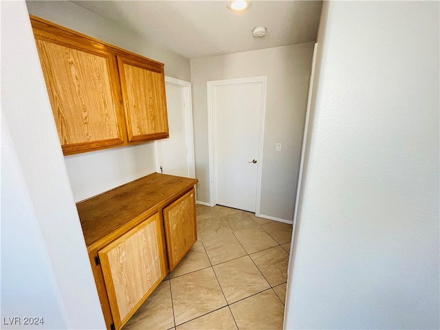 hallway with light tile patterned flooring