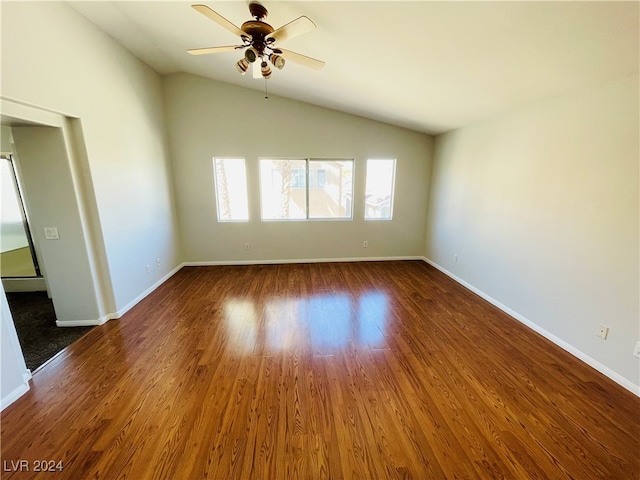 spare room featuring lofted ceiling, ceiling fan, and dark hardwood / wood-style floors