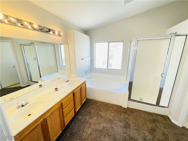 bathroom with vanity, lofted ceiling, and plus walk in shower