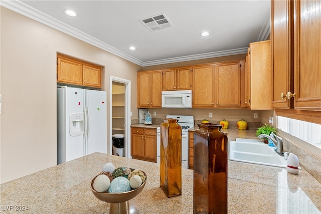 kitchen featuring ornamental molding, sink, and white appliances