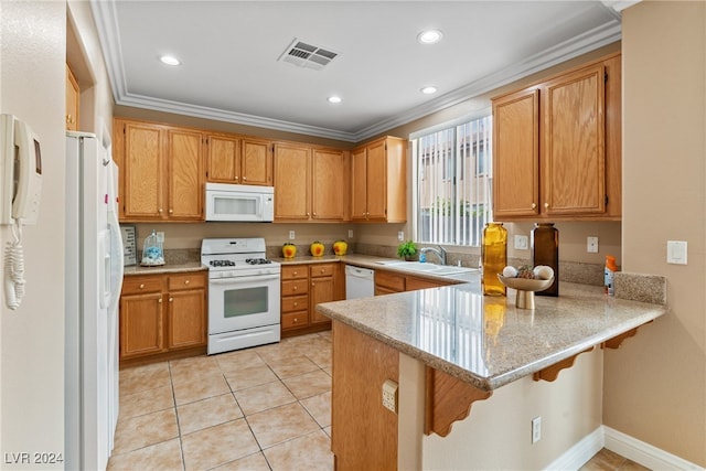 kitchen featuring white appliances, sink, a breakfast bar, kitchen peninsula, and light tile patterned floors