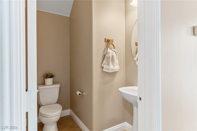 bathroom with toilet and sink