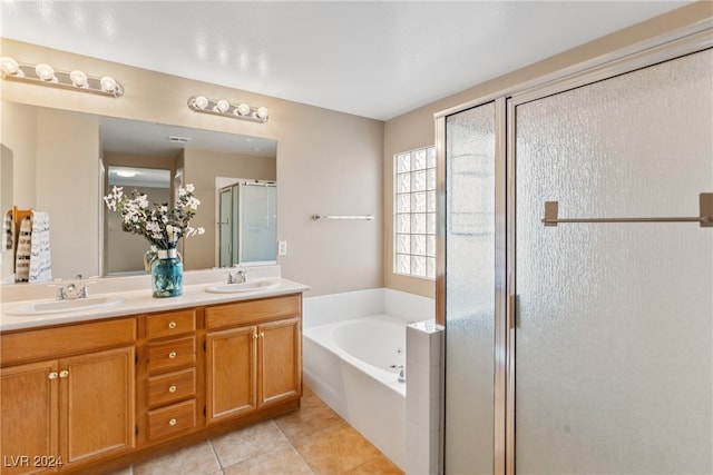 bathroom featuring vanity, tile patterned floors, and separate shower and tub