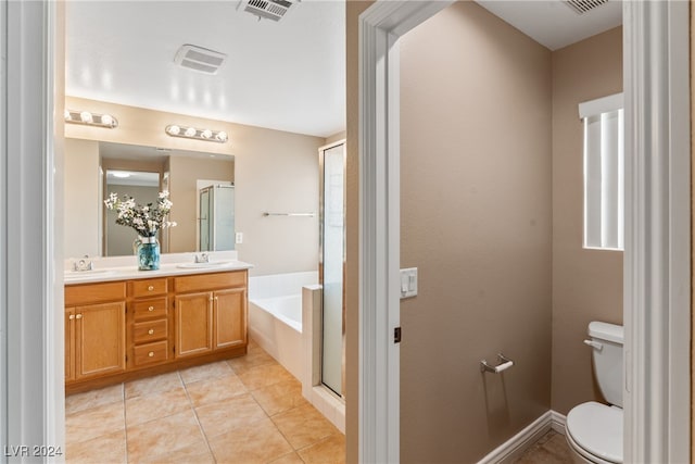 full bathroom featuring vanity, toilet, tile patterned floors, and shower with separate bathtub