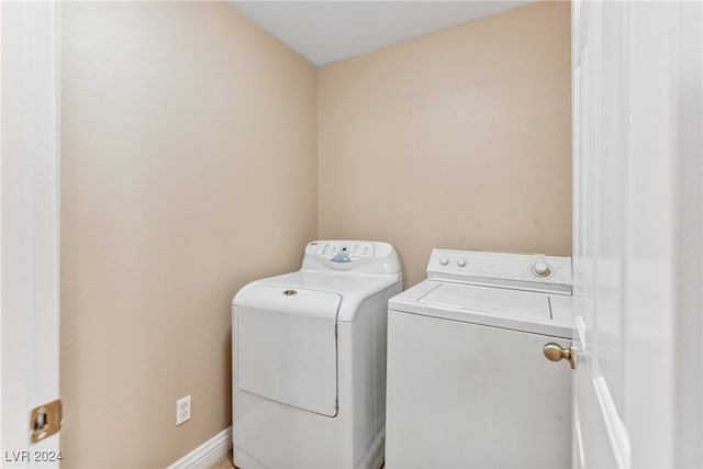 clothes washing area with independent washer and dryer