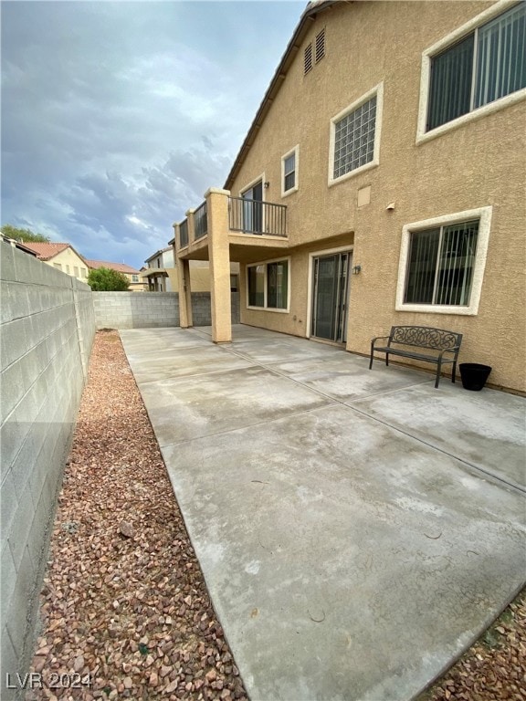 back of property featuring a patio