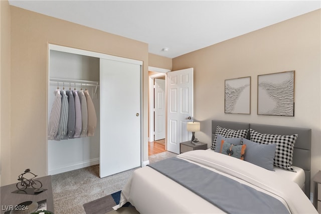 carpeted bedroom featuring a closet