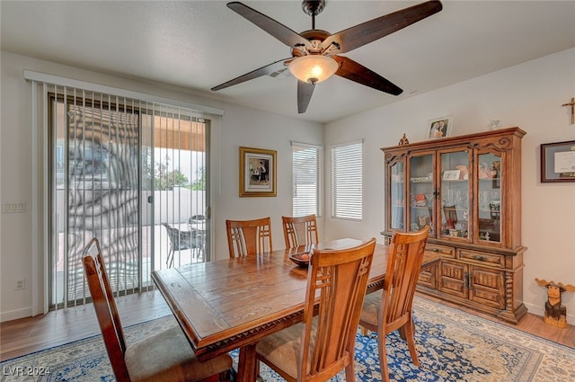 dining room with ceiling fan and hardwood / wood-style floors