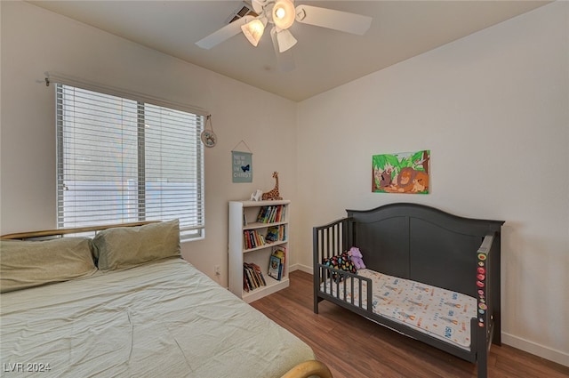 bedroom featuring dark hardwood / wood-style flooring and ceiling fan