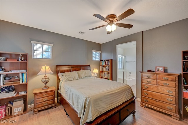 bedroom featuring light hardwood / wood-style flooring, connected bathroom, and ceiling fan