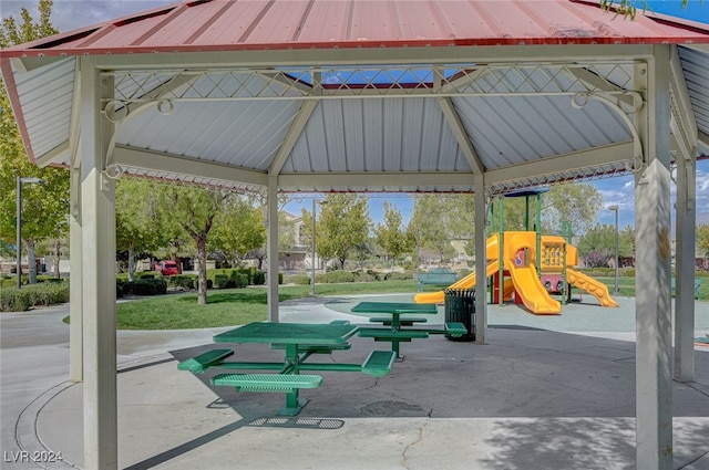 view of property's community featuring a playground, a gazebo, and a yard