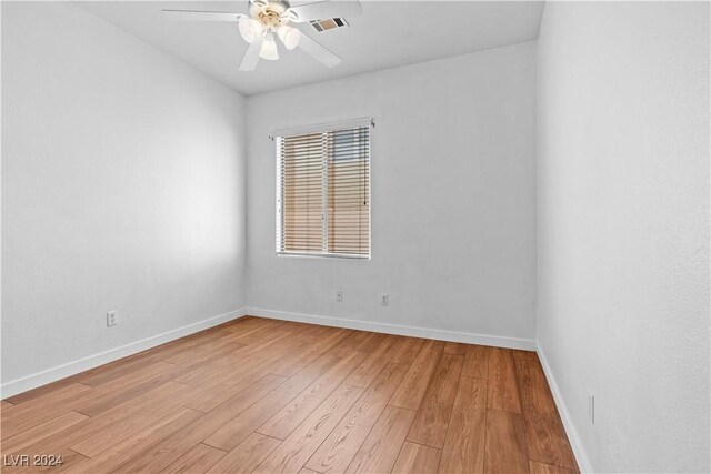 unfurnished room with ceiling fan and light hardwood / wood-style flooring