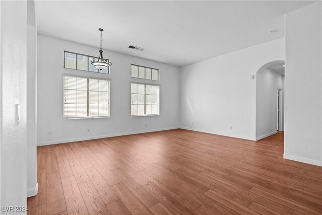 spare room with light wood-type flooring