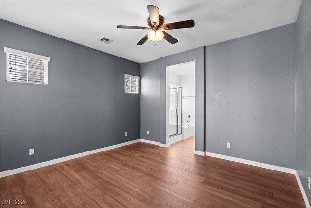 empty room with wood-type flooring and ceiling fan