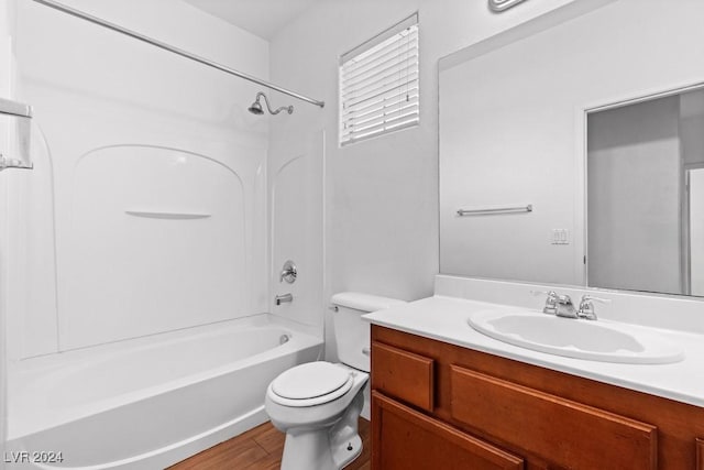 bathroom featuring vanity,  shower combination, toilet, and wood finished floors