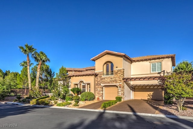 mediterranean / spanish-style home featuring a garage