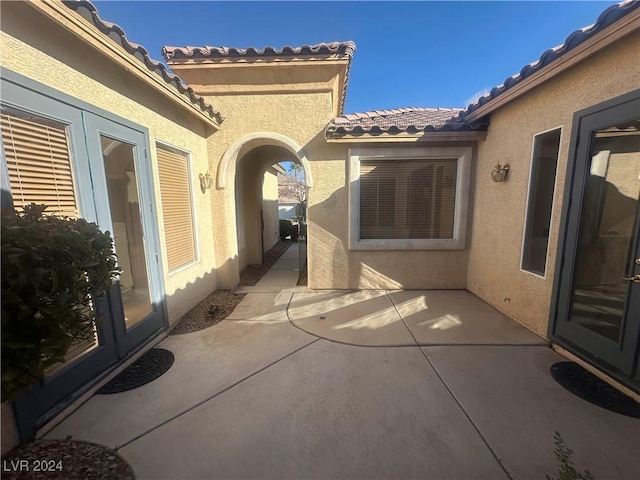 view of patio featuring french doors