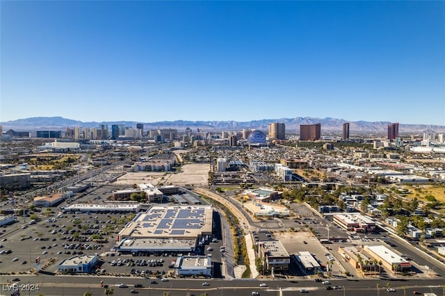 birds eye view of property with a mountain view