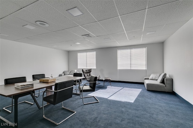 carpeted office space featuring a drop ceiling