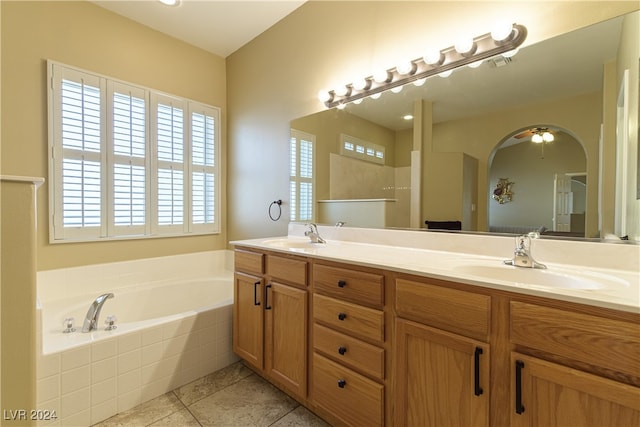 bathroom with vanity, ceiling fan, tile patterned floors, and a relaxing tiled tub