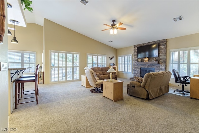 carpeted living room with high vaulted ceiling, ceiling fan, and a fireplace