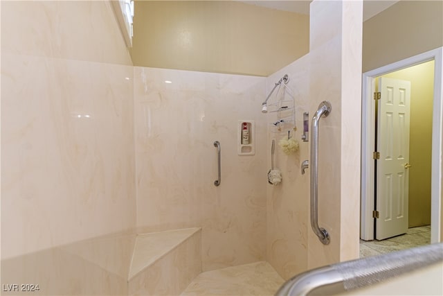 bathroom with tiled shower