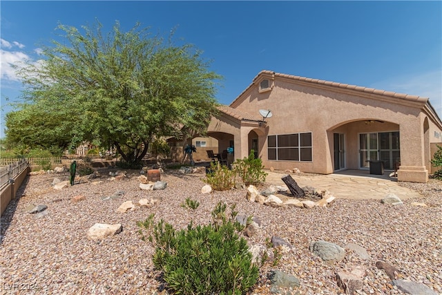 rear view of house with a patio