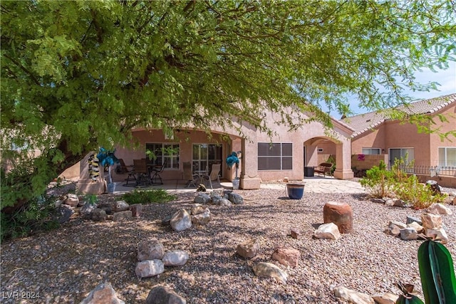 1214 Country Club Dr, Laughlin, NV 89029 - back of property featuring a patio area and stucco siding
