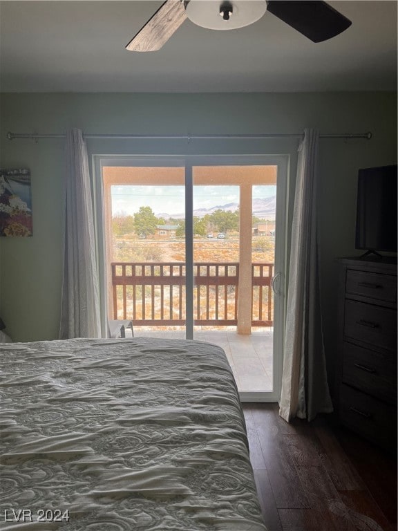 bedroom with access to outside, dark hardwood / wood-style flooring, and ceiling fan