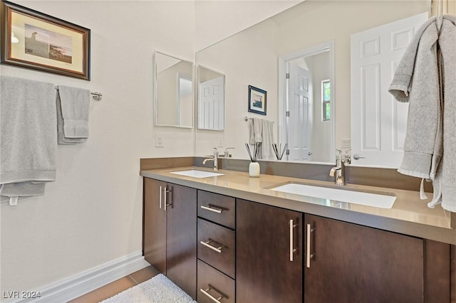 6 Lago Turchino Ct, Henderson, NV 89011 - full bathroom with a sink, baseboards, double vanity, and tile patterned flooring