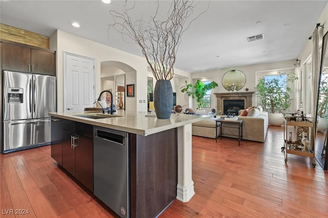 6 Lago Turchino Ct, Henderson, NV 89011 - kitchen featuring visible vents, a sink, light countertops, appliances with stainless steel finishes, and light wood-style flooring