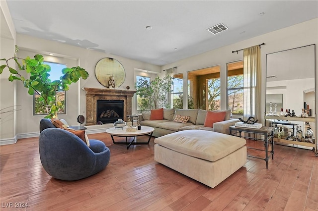 6 Lago Turchino Ct, Henderson, NV 89011 - living room featuring visible vents, hardwood / wood-style floors, and a high end fireplace