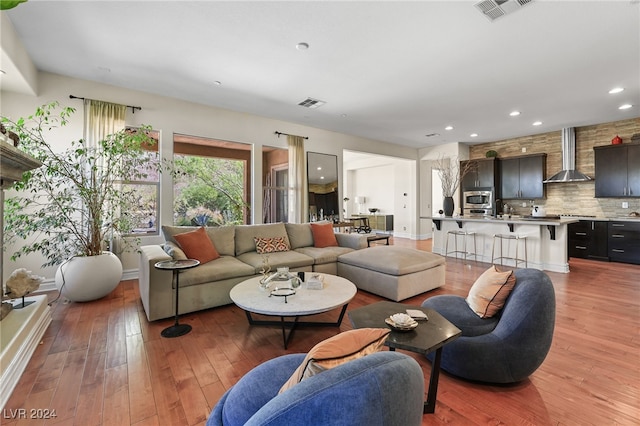 living room with light hardwood / wood-style flooring