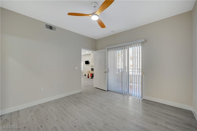 unfurnished room featuring light hardwood / wood-style flooring and ceiling fan