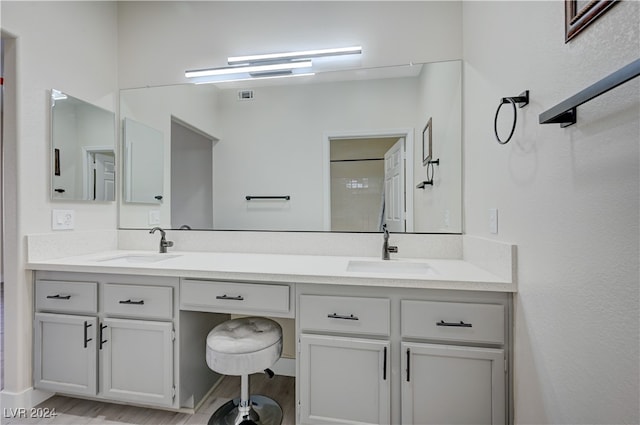 bathroom featuring wood-type flooring and vanity