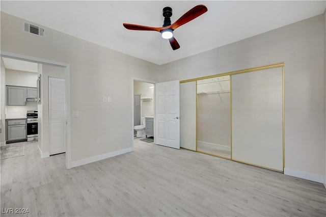 unfurnished bedroom with ceiling fan and light wood-type flooring