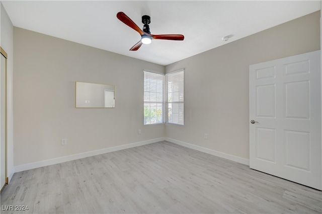 unfurnished bedroom featuring ceiling fan and light wood-type flooring