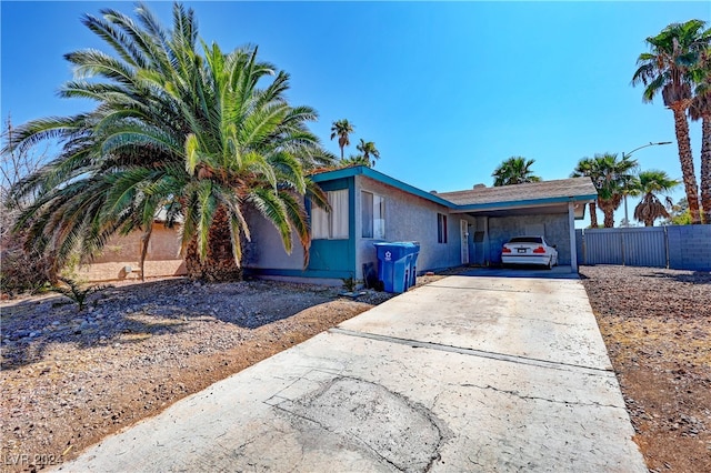 single story home with a carport