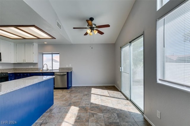 kitchen with white cabinetry, blue cabinetry, vaulted ceiling, stainless steel dishwasher, and sink