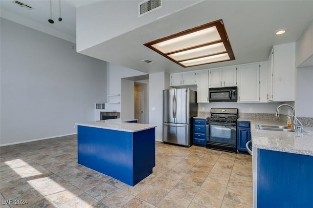 kitchen featuring white cabinetry, blue cabinets, black appliances, light stone counters, and sink