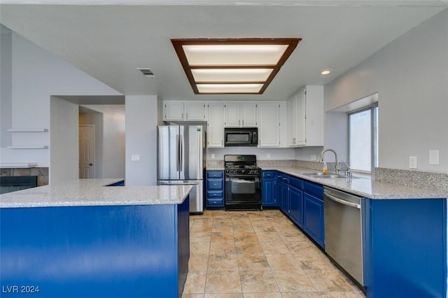 kitchen featuring black appliances, kitchen peninsula, sink, white cabinets, and blue cabinets