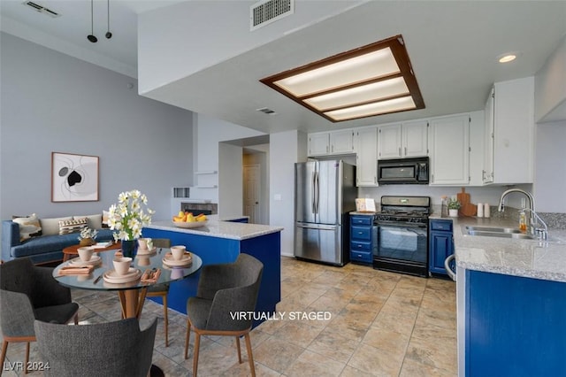 kitchen featuring blue cabinetry, black appliances, white cabinets, light stone counters, and sink