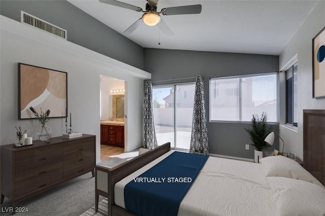 bedroom featuring ceiling fan, light colored carpet, access to exterior, vaulted ceiling, and ensuite bathroom