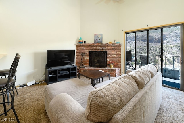 living room with light carpet and a brick fireplace